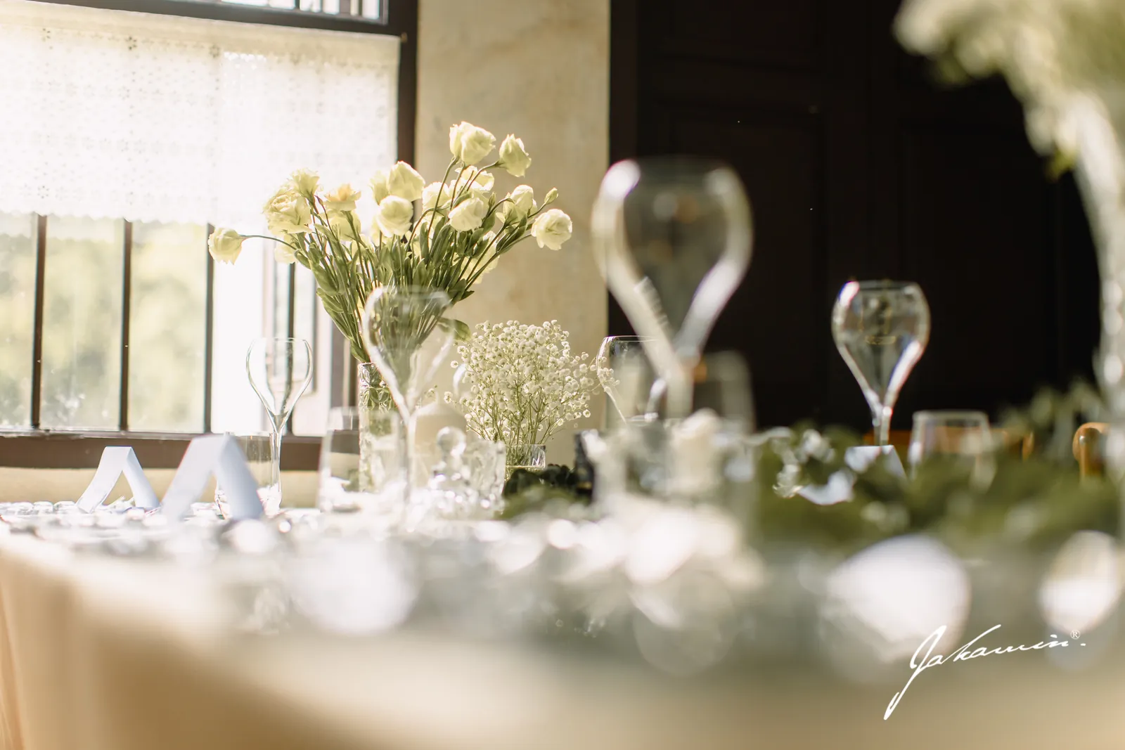 A wedding table setting at Baan Ar-Jor — florals, glassware and heritage china