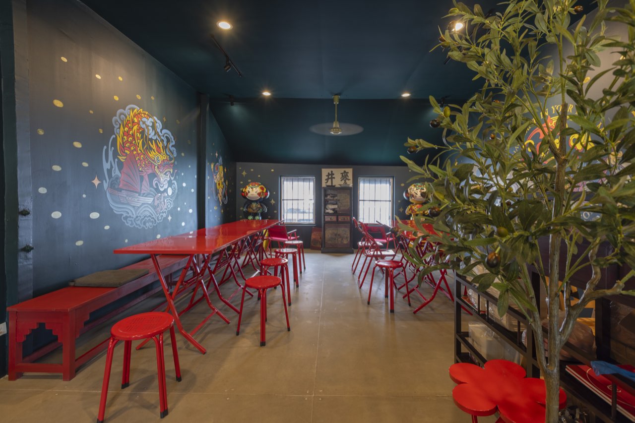 Old Town Private Room — 2nd-floor private dining room with red folding tables, dragon-ship mural and teal walls